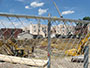 view of construction site through chain link fence