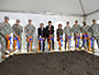 Groundbreaking, November, 2013. 8 soldiers, Dean Gallagher and Ron Chez with shovels pretending to dig the open dirt